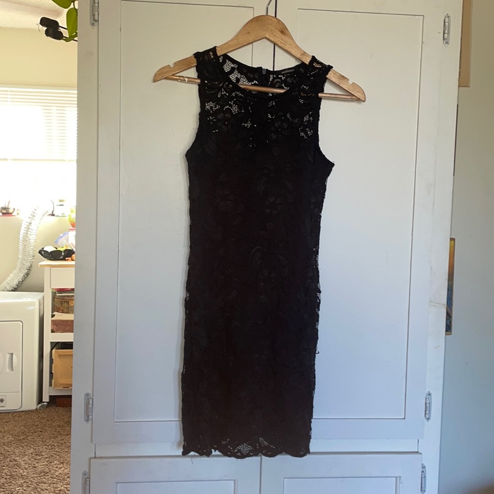 Classy meets sexy little black dress from Ambiance, size M but will fit S
